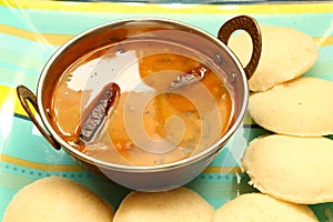 Idly with sambar Iddli is a traditional breakfast of South Indian households,its a very popular savory dish of South Indian