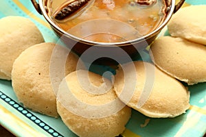 Idly with sambar Iddli is a traditional breakfast of South Indian households,its a very popular savory dish of South Indian