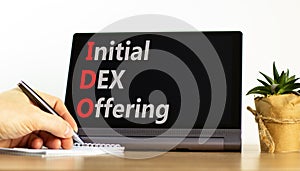 IDO initial DEX offering symbol. Concept words IDO initial DEX offering on beautiful black tablet. Beautiful white background.
