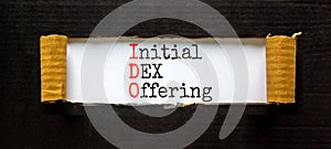 IDO initial DEX offering symbol. Concept words IDO initial DEX offering on beautiful white paper. Beautiful black paper background