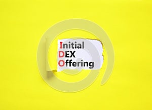 IDO initial DEX offering symbol. Concept words IDO initial DEX offering on beautiful white paper. Beautiful yellow paper