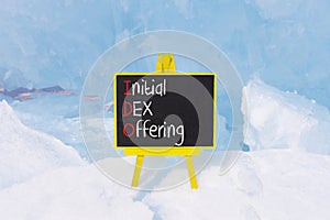 IDO initial DEX offering symbol. Concept words IDO initial DEX offering on beautiful yellow blackboard. Beautiful blue ice