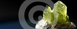 Idocrase Vesuvianite is rare precious natural stone on black background. AI generated. Header banner mockup with space. photo