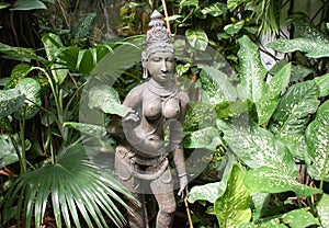 Idol of hindu deity in greenery