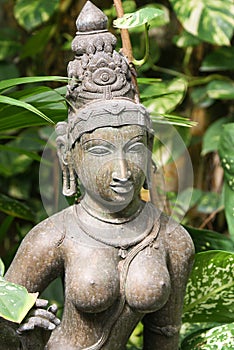 Idol of hindu deity in greenery