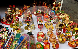 Idols and dolls at mercado de las brujas in Bolivia photo