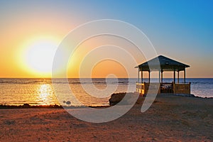 Idylic beach with gazebo within sunrise,  Marsa Alam , Red Sea, Egypt photo