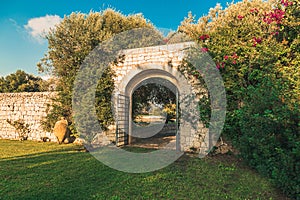 Old arc gateway in a garden in Italy