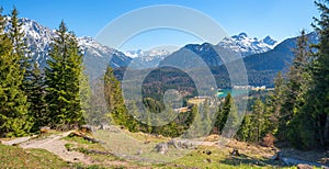 Idyllic alpine landscape, view from Kranzberg mountain trail to lake Lautersee and the alps