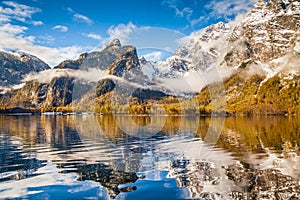 Idyllic autumn landscape with mountain lake in the Alps