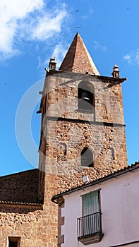 Idyllic church with a bell tower stands in a picturesque countryside setting