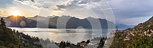 Idyllic coastline in Italy: Blue water and a cute village at lago di garda, Malcesine, sunset