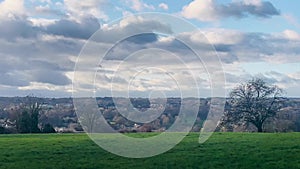 Idyllic English countryside view with vibrant green fields under a blue sky in early spring in Hemel Hempstead