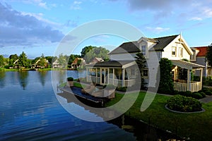 Idyllic holiday homes lakeside by sunrise photo