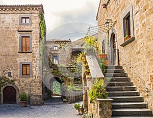 Idyllic inner alley of Civita di Bagnoregio, ghost mediaeval town built above a plateau of friable volcanic tuff, Lazio, central I