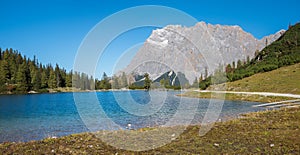 Idyllic lake seebensee in the austrian alps with view to zugspitze mountain