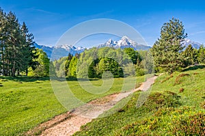 Idyllic landscape in the Alps with hiking path and mountains