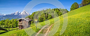 Idyllic landscape in the Alps with mountain lodge in springtime