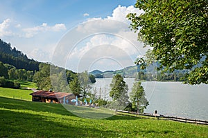 Idyllic landscape lake Schliersee, tourist resort and cosy cabin with restaurant
