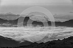 Idyllic landscape of silhouette of natural landmark Lion Rock in Hong Kong city at dawn