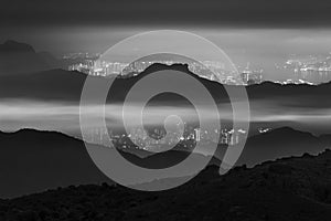 Idyllic landscape of silhouette of natural landmark Lion Rock in Hong Kong city in monochrome