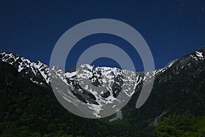 Idyllic landscape of starry night over Hotaka mountain range, Kamikochi national park, Kamikochi, Japan