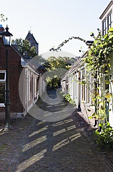 An idyllic, narrow street in Garnwerd, Holland photo