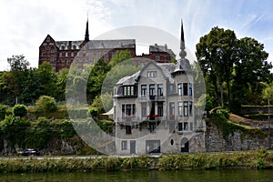 Idyllic old buildings at the banks of Meuse river  in Dinant