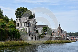 Idyllic old buildings at the banks of Meuse river  in Dinant