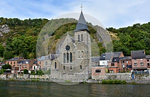 Idyllic old buildings at the banks of Meuse river  in Dinant