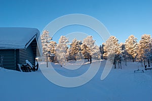 Idyllic panoramic cold winter view in the arctics with lot of snow and blue sky.