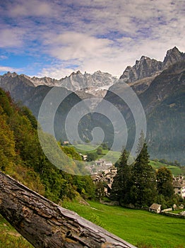 Idyllic and picturesque mountain village in the Alps of Switzerland with a great mountain landscape view behind