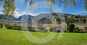 Idyllic place at spa garden Schliersee with  lake view and bavarian alps, in autumn