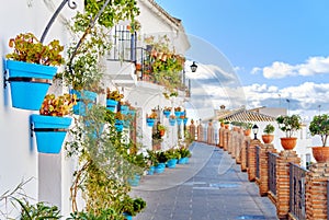 Idyllic scenery empty picturesque street of small white-washed village of Mijas