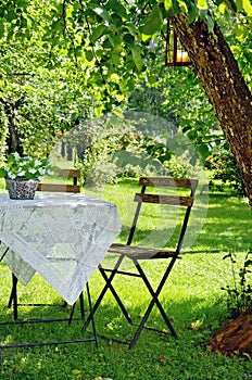 Idyllic setting of a table and wooden chair