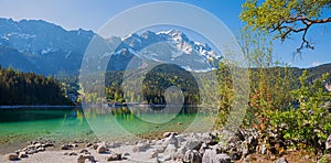 idyllic spring landscape alpine lake Eibsee and Zugspitze mountain mass, upper bavaria