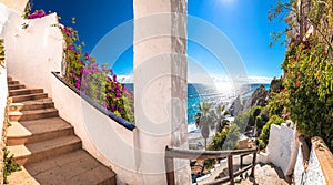 Idyllic stairs to beach in Nerja panoramic view