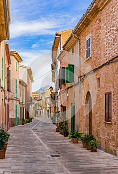Idyllic street with mediterranean buildings in the old town of Alcudia on Majorca island, Spain