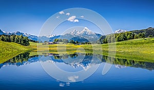 Idyllic summer landscape with clear mountain lake in the Alps