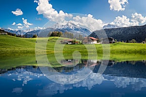 Idyllic summer landscape with clear mountain lake in the Alps