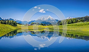Idyllic summer landscape with clear mountain lake in the Alps photo