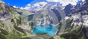 Idyllic swiss mountain lake Oeschinensee (Oeschinen) with turquise water and snowy peaks of Alps mountains.Switzerland