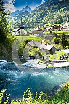 The idyllic Swiss village of Jaun and the Jaunfall waterfall in the Alps of canton Fribourg photo