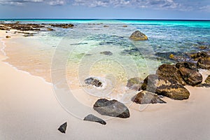 Idyllic and translucent caribbean beach at sunny day in Aruba