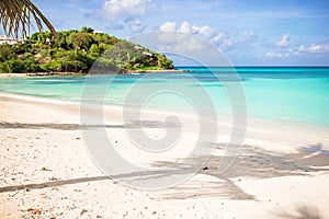Idyllic tropical beach in Caribbean with white sand, turquoise ocean water and blue sky photo