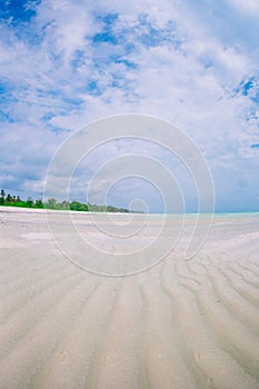 Idyllic tropical beach in Caribbean with white sand, turquoise ocean water and blue sky photo