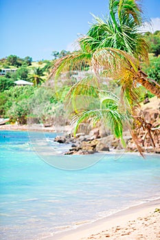 Idyllic tropical beach with white sand, turquoise ocean water and blue sky