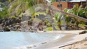 Idyllic tropical Carlisle bay beach with white sand, turquoise ocean and blue sky at Antigua island in Caribbean