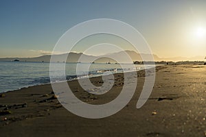 Idyllic tropical island beach scene at sunrise