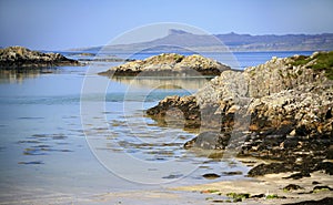 Idyllic turquoise sea, beach and Island of Eigg